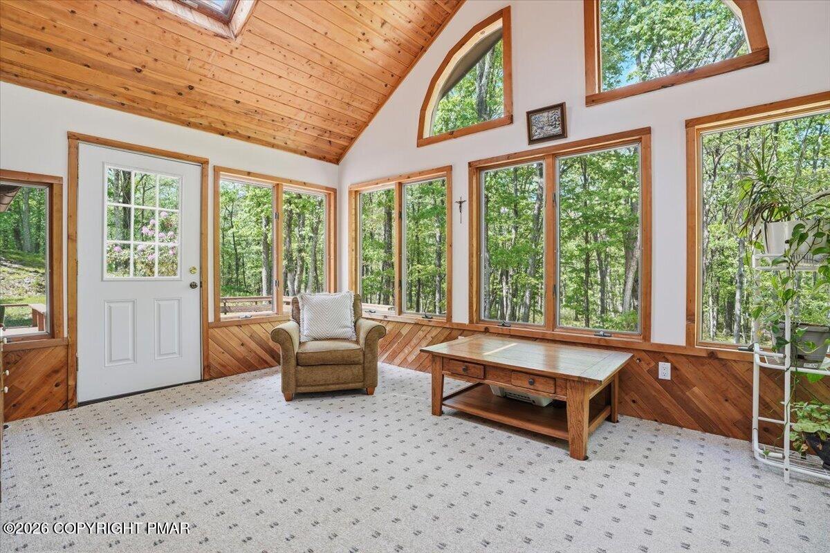 1517 Deer Run East Bushkill, PA 18324 - Photo 12 of 42 a living room with furniture and large windows
