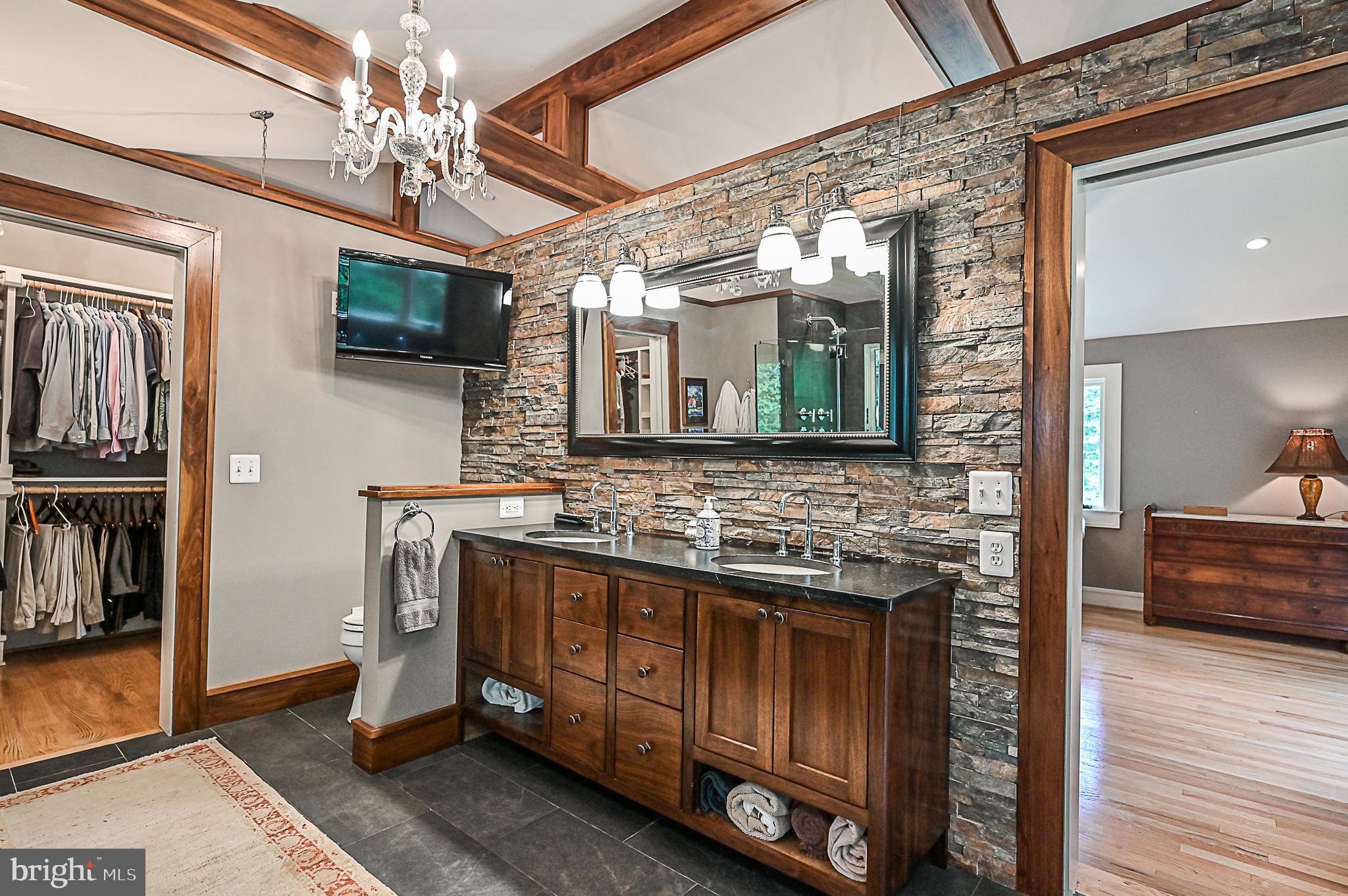 10600 Hunters Valley Road Vienna, VA 22181 - Photo 19 of 50 Luxury Spa Bath with Accent Stone Wall
