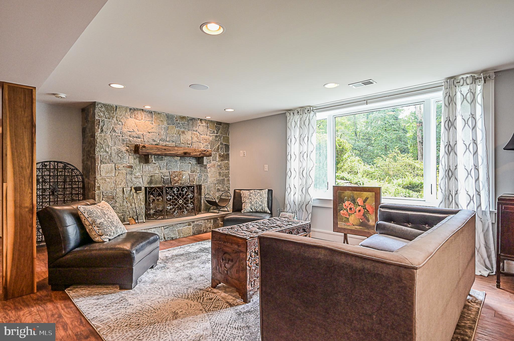 10600 Hunters Valley Road Vienna, VA 22181 - Photo 36 of 50 Stone Wood Burning Fireplace in Recreation Room