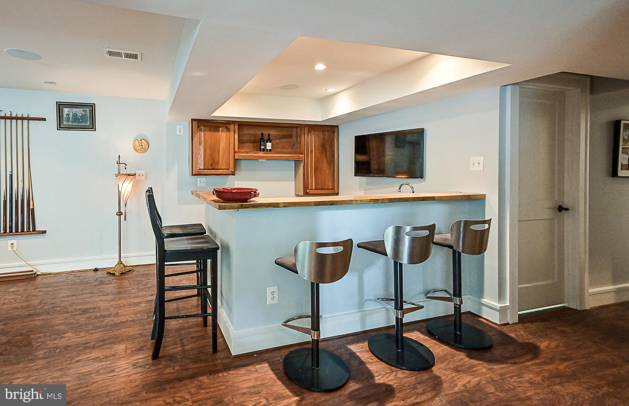 10600 Hunters Valley Road Vienna, VA 22181 - Photo 40 of 50 Wet Bar w/ Granite Counters & SubZero Mini Fridge