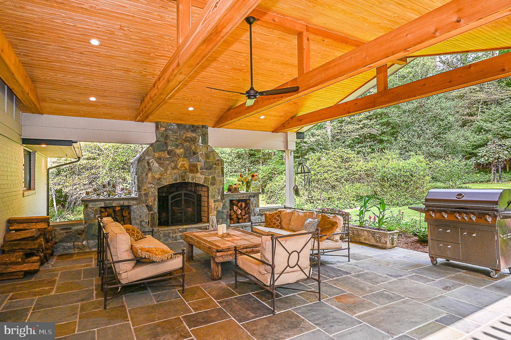 10600 Hunters Valley Road Vienna, VA 22181 - Photo 41 of 50 Outdoor Entertaining Area with Stone Fireplace