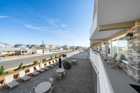 a view of a balcony with chairs