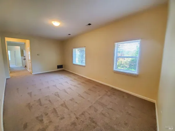 a view of an empty room with a window