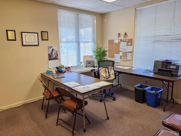 a view of a workspace with furniture
