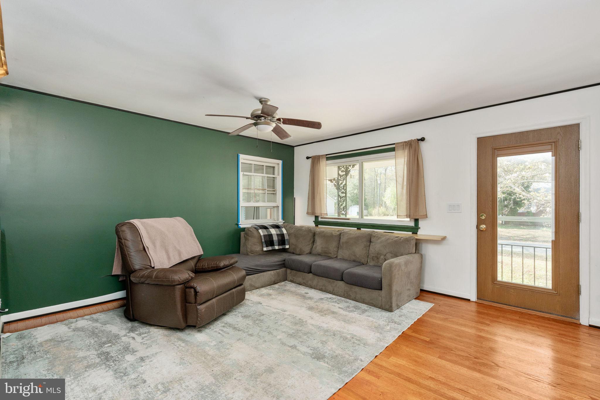 160 12th Street Colonial Beach, VA 22443 - Photo 11 of 60 a living room with furniture and a window