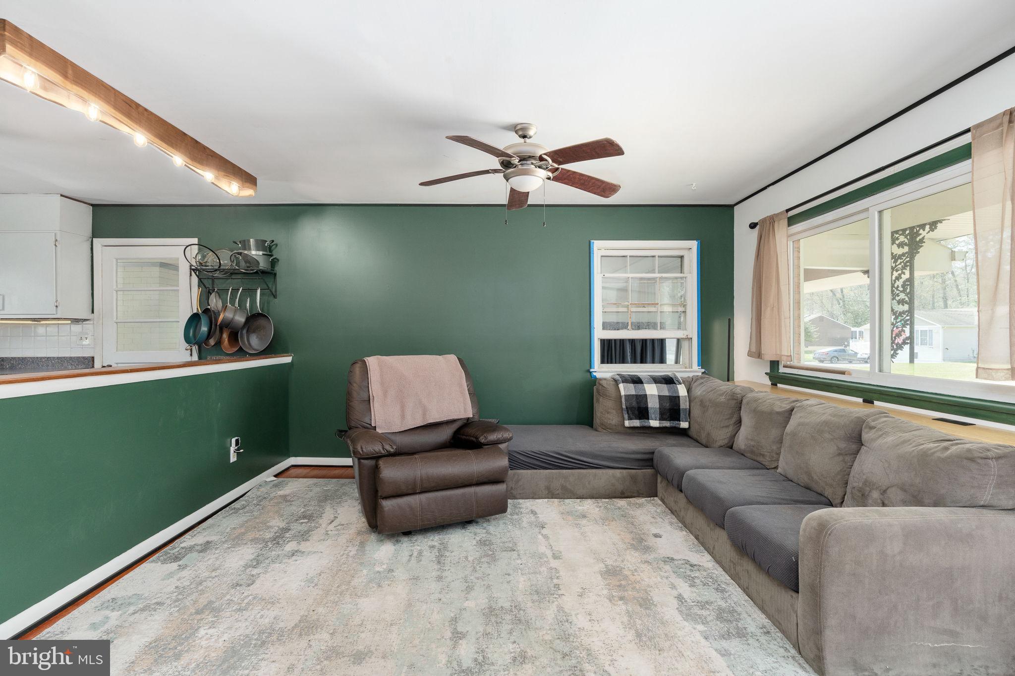 160 12th Street Colonial Beach, VA 22443 - Photo 13 of 60 a living room with furniture and a large window