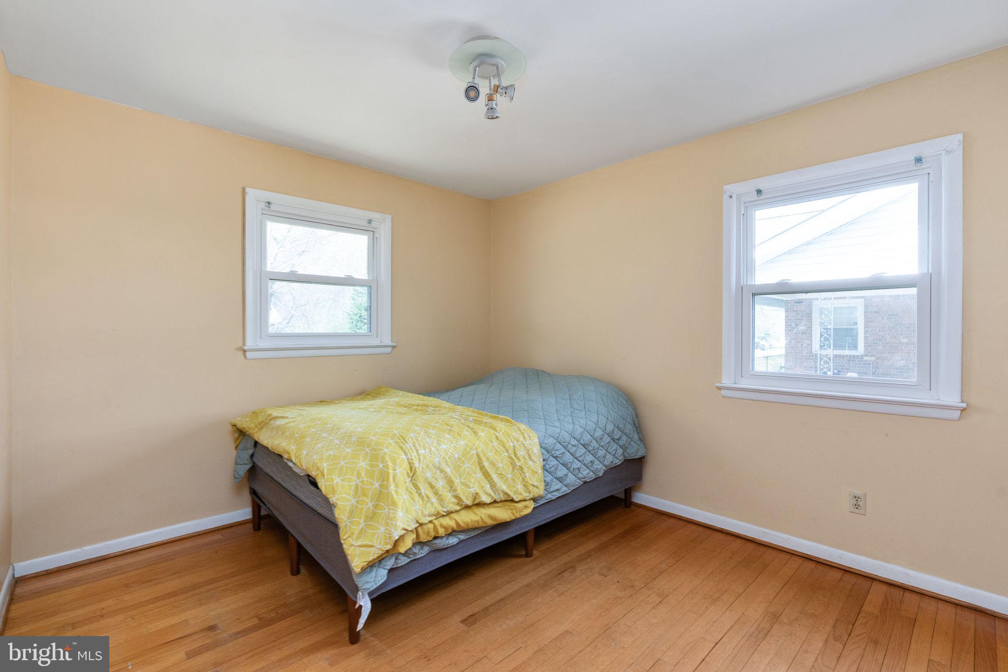 160 12th Street Colonial Beach, VA 22443 - Photo 20 of 60 a bedroom with a bed and window