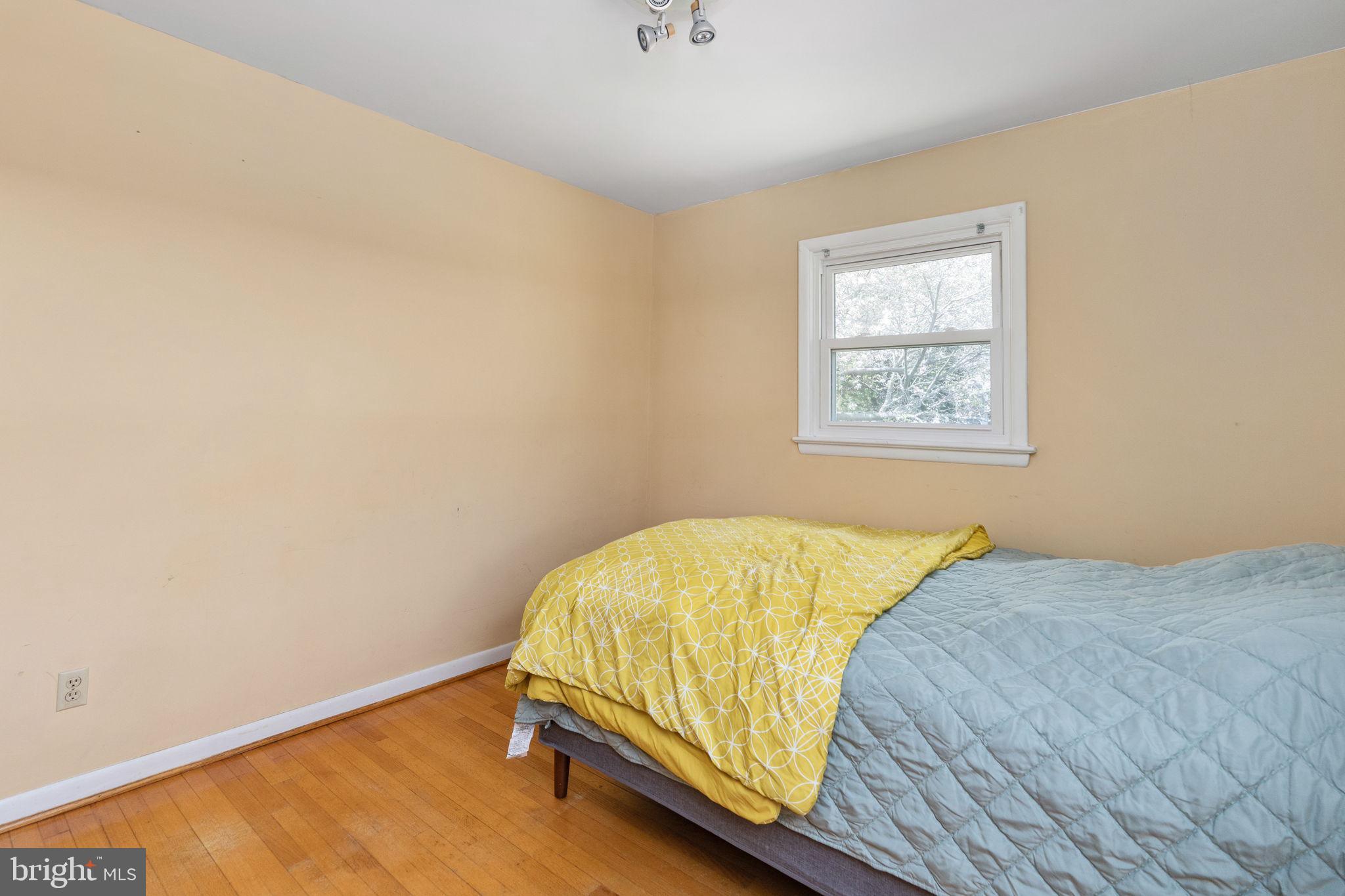 160 12th Street Colonial Beach, VA 22443 - Photo 21 of 60 a bedroom with a bed and a window