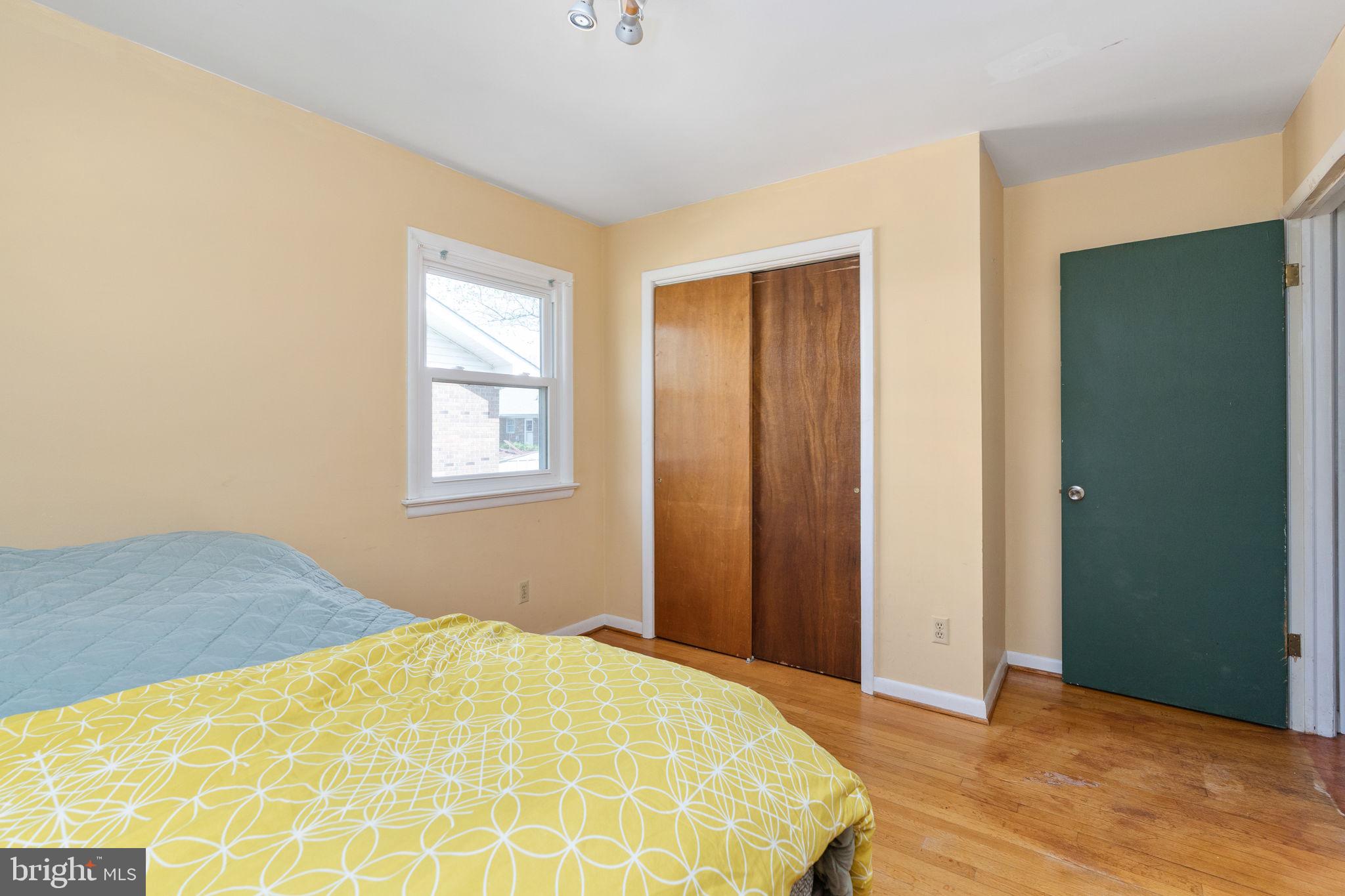 160 12th Street Colonial Beach, VA 22443 - Photo 22 of 60 a bedroom with a bed and a window