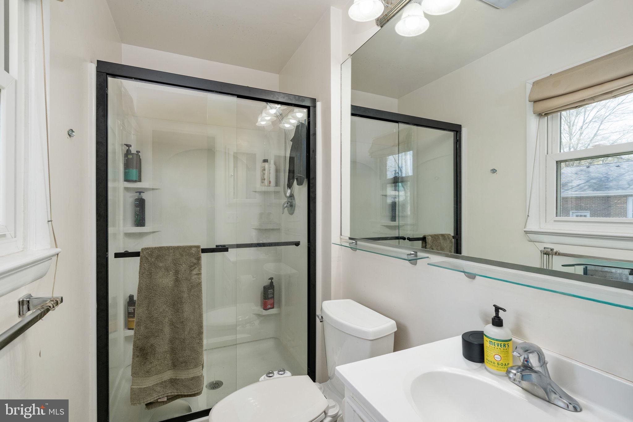 160 12th Street Colonial Beach, VA 22443 - Photo 26 of 60 a bathroom with a sink and a mirror