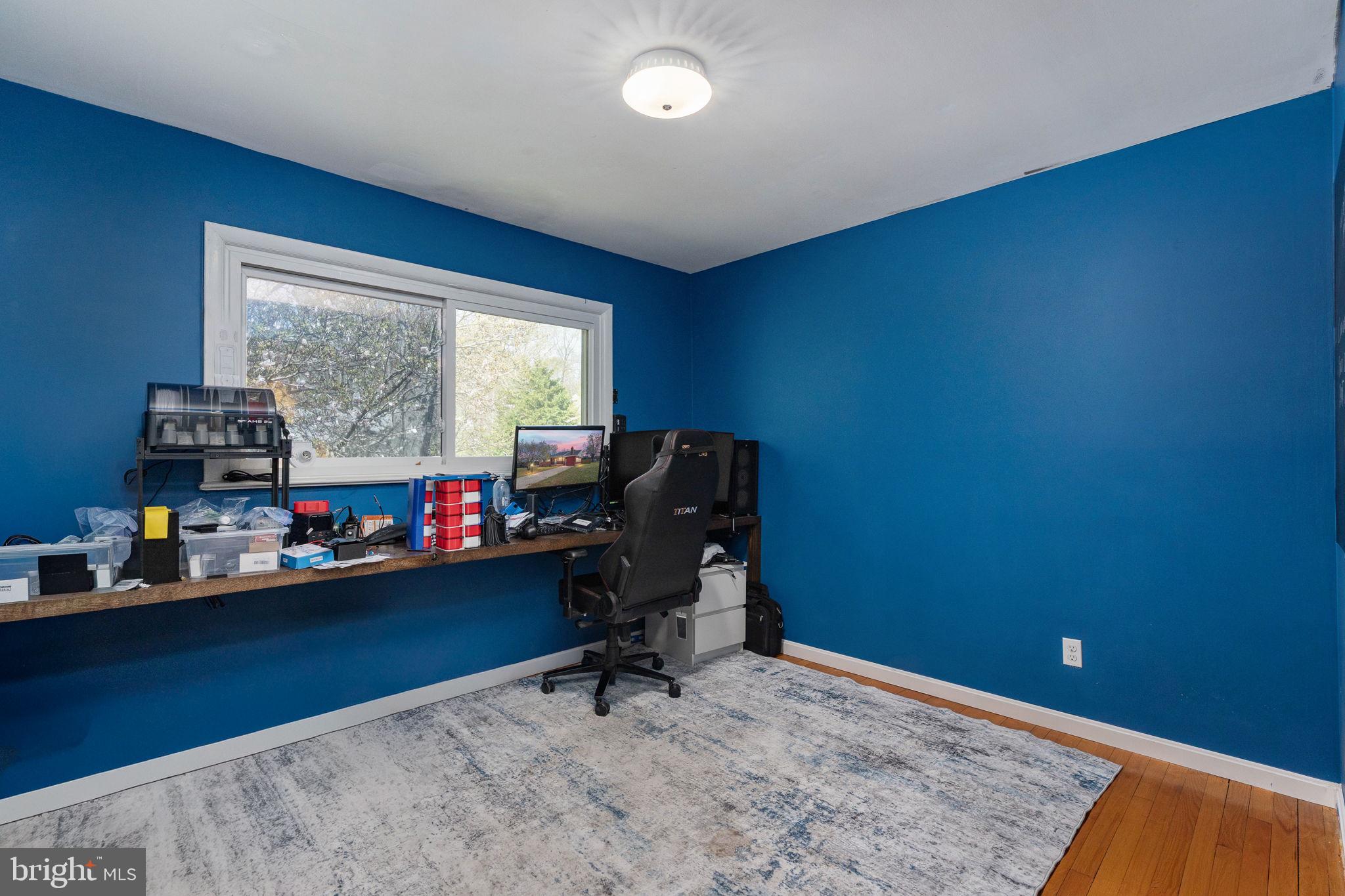 160 12th Street Colonial Beach, VA 22443 - Photo 28 of 60 a view of a workspace with furniture and a window