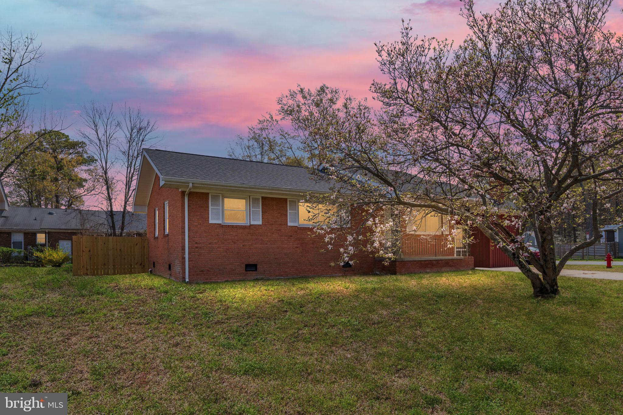 160 12th Street Colonial Beach, VA 22443 - Photo 43 of 60 a view of a house with yard and a tree