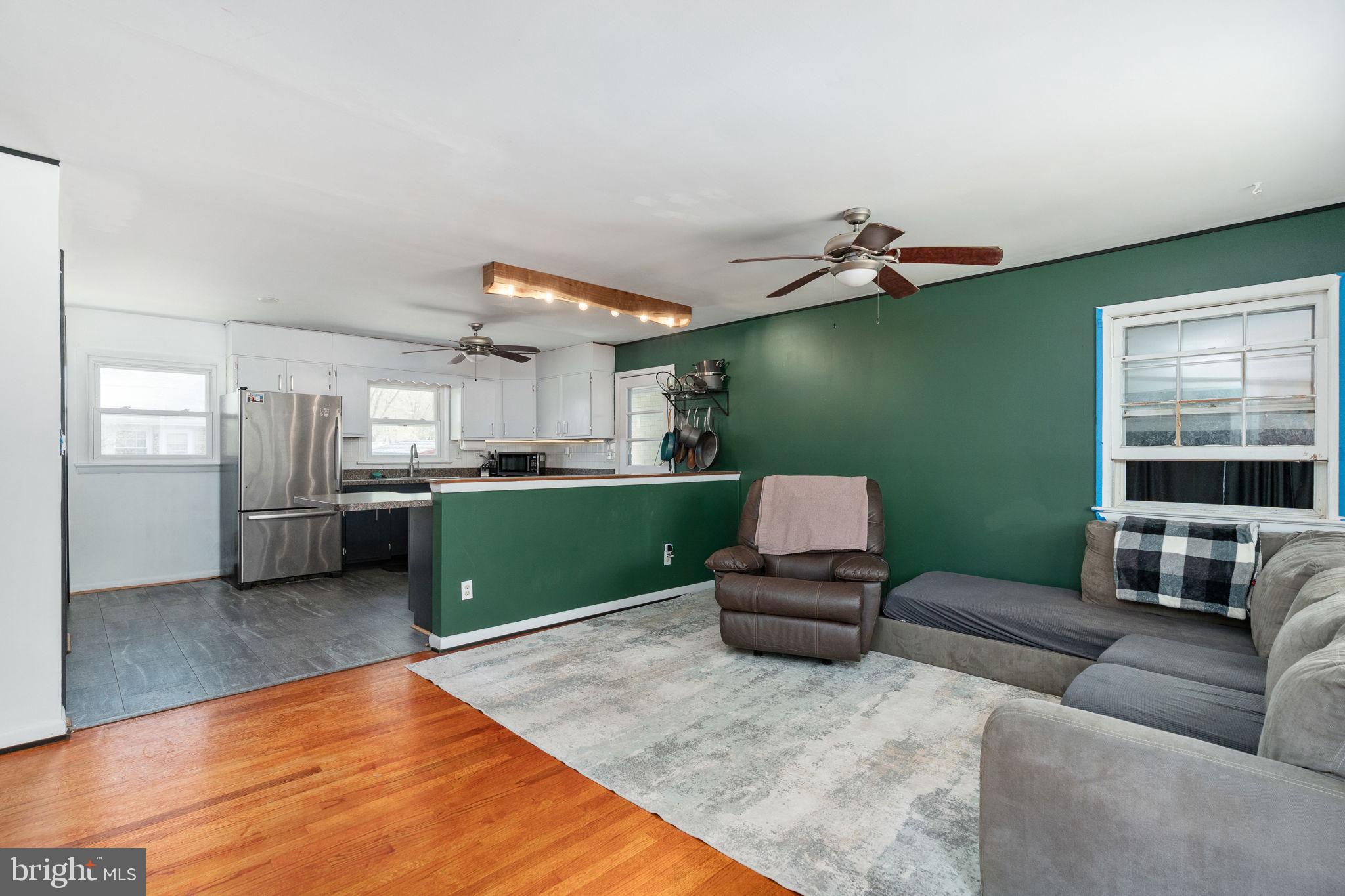 160 12th Street Colonial Beach, VA 22443 - Photo 10 of 60 a living room with furniture and kitchen view
