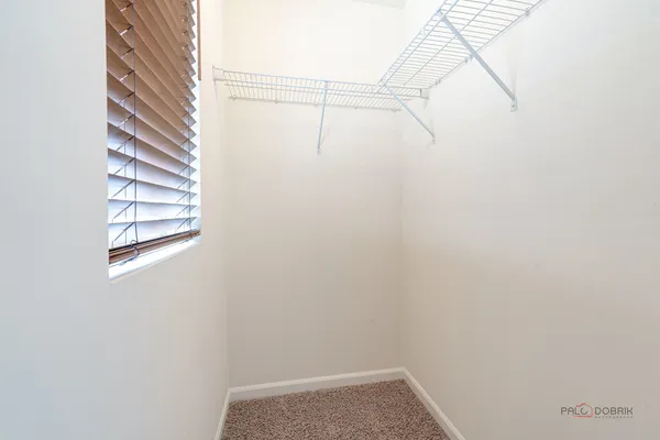 a view of a small space with racks on the wall