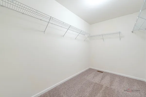 a view of a room with racks on the wall