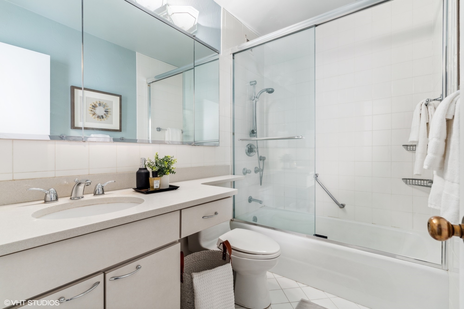 100 East Bellevue Place, Unit 18D Chicago, IL 60611 - Photo 11 of 24 a bathroom with a sink toilet and shower