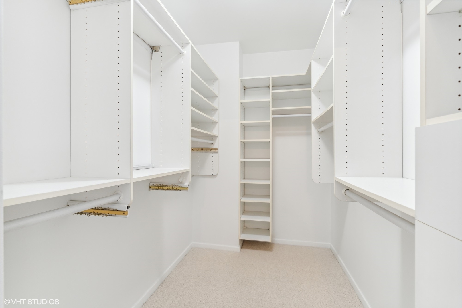 100 East Bellevue Place, Unit 18D Chicago, IL 60611 - Photo 12 of 24 a view of walk in closet with empty racks
