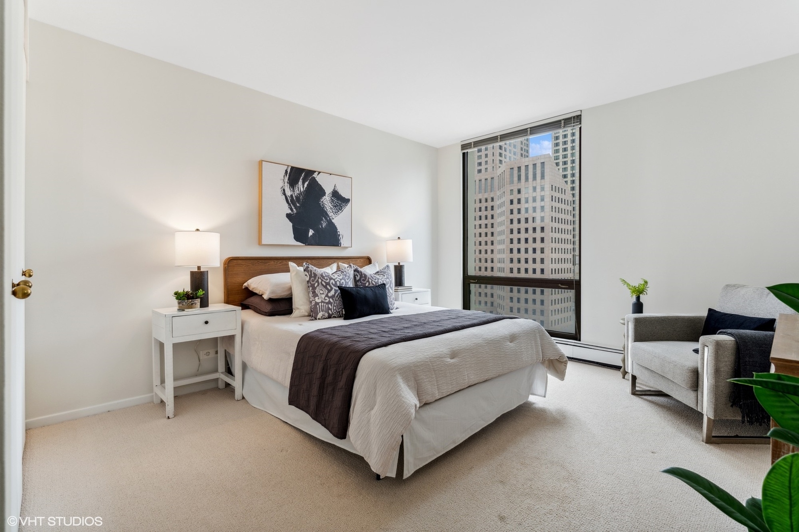 100 East Bellevue Place, Unit 18D Chicago, IL 60611 - Photo 13 of 24 a spacious bedroom with a bed and window