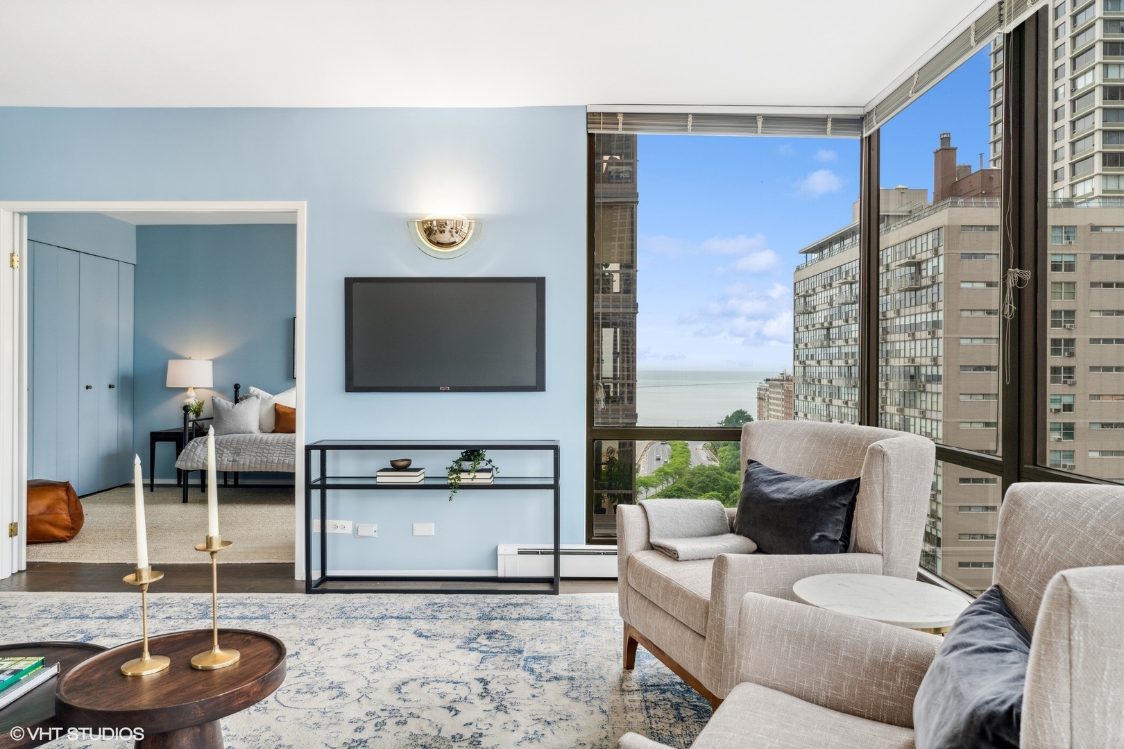 100 East Bellevue Place, Unit 18D Chicago, IL 60611 - Photo 5 of 24 a living room with furniture and a flat screen tv