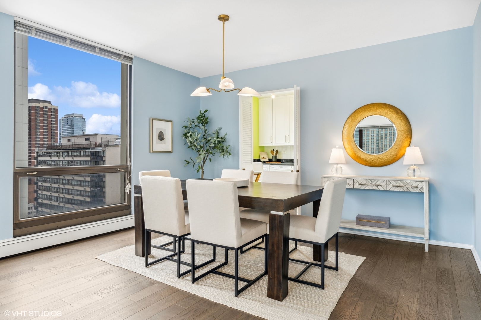 100 East Bellevue Place, Unit 18D Chicago, IL 60611 - Photo 7 of 24 a dining room with furniture and a chandelier
