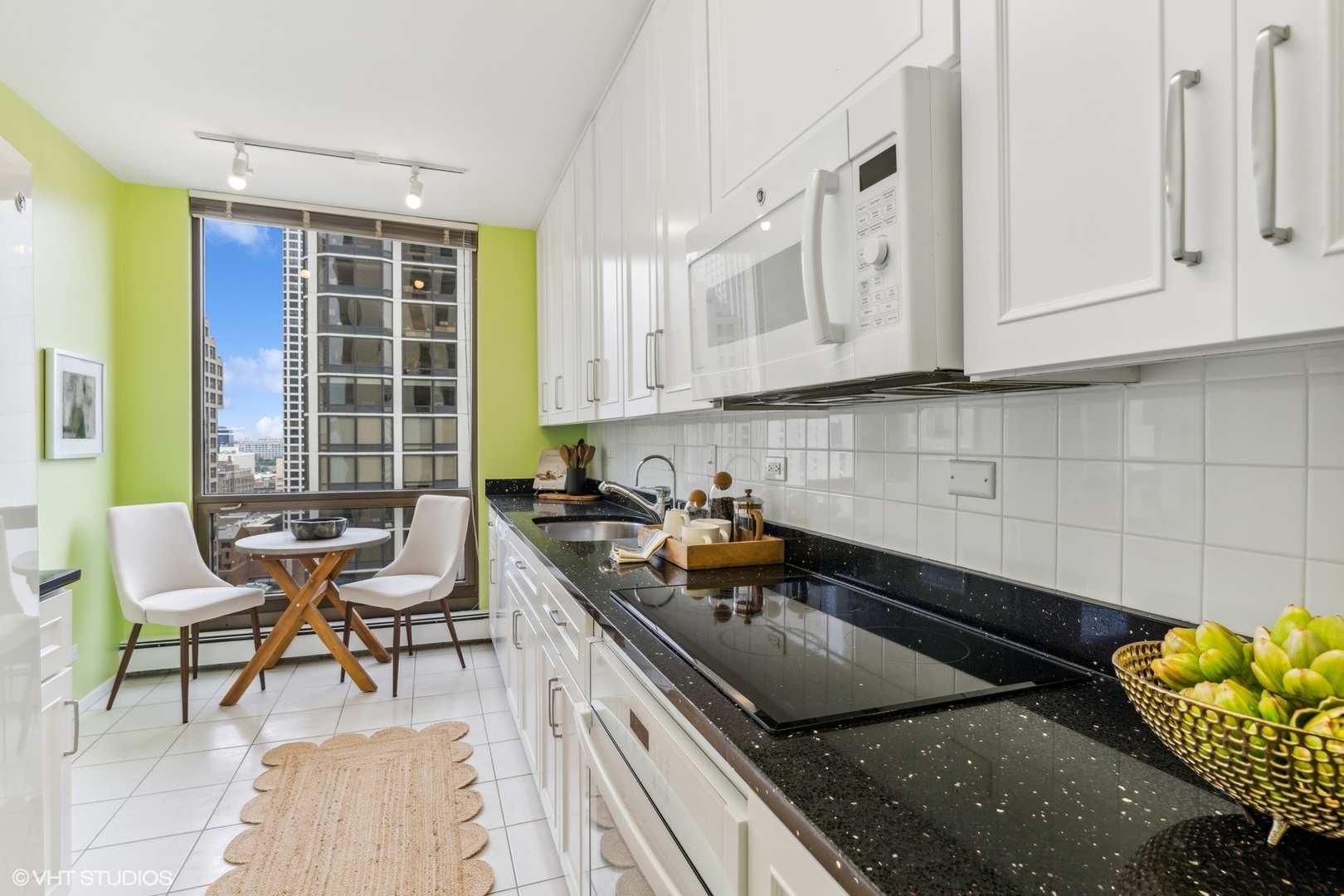100 East Bellevue Place, Unit 18D Chicago, IL 60611 - Photo 8 of 24 a kitchen that has a sink and a stove