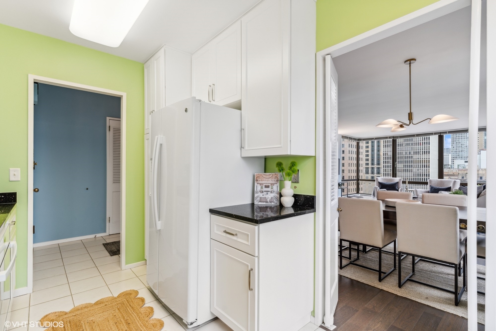 100 East Bellevue Place, Unit 18D Chicago, IL 60611 - Photo 9 of 24 a kitchen with a sink and a refrigerator