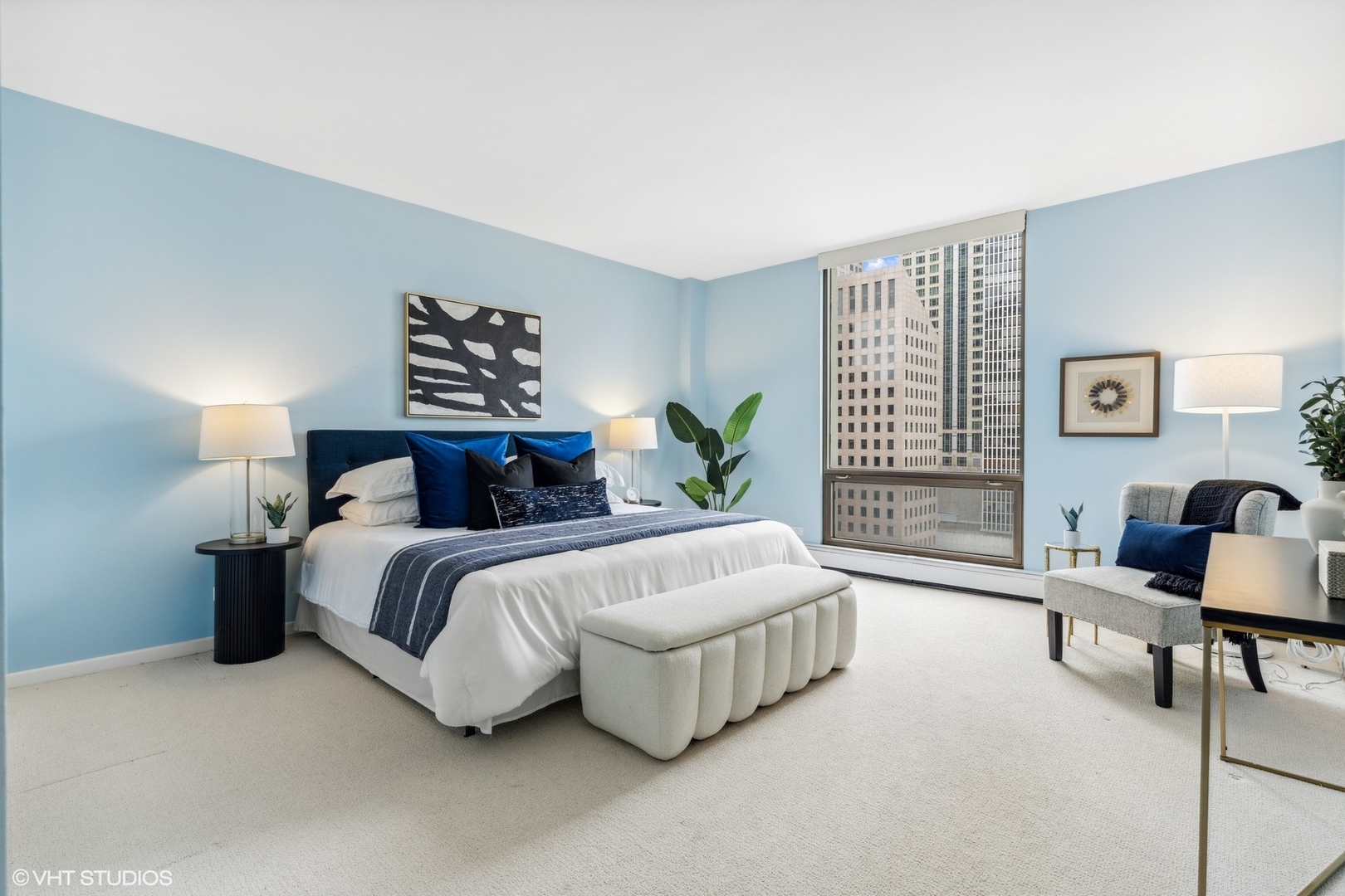 100 East Bellevue Place, Unit 18D Chicago, IL 60611 - Photo 10 of 24 a spacious bedroom with a bed and a couch