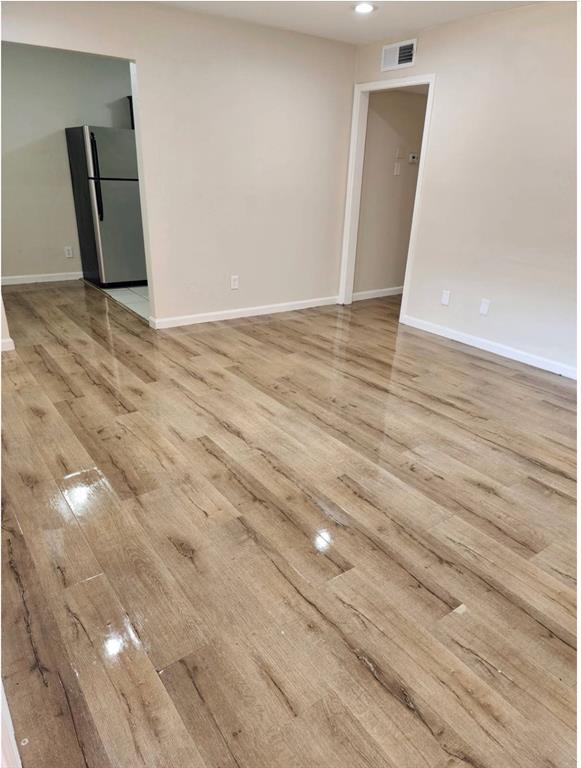 4618 Reiger Avenue, Unit 103 Dallas, TX 75246 - Photo 5 of 7 a view of an empty room