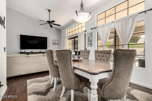 a dining room with furniture and window