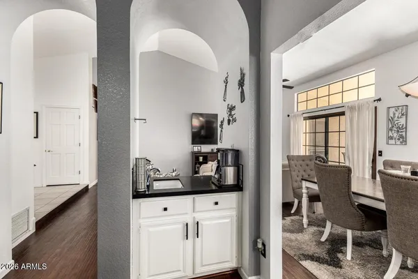 a en suite bathroom with a sink a mirror and a shower