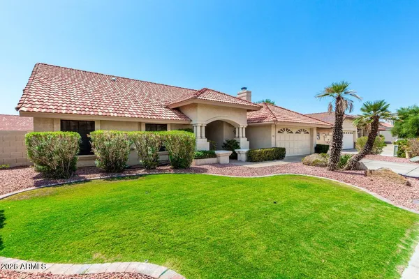 a view of a house with a yard porch and sitting area