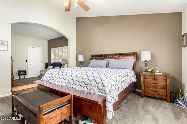 a bedroom with a bed and a dresser