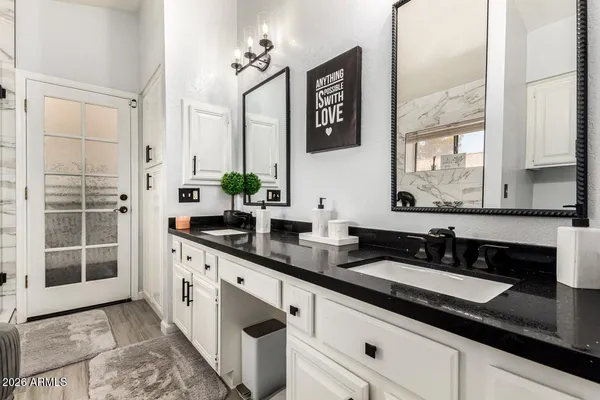 a bathroom with a sink and a mirror