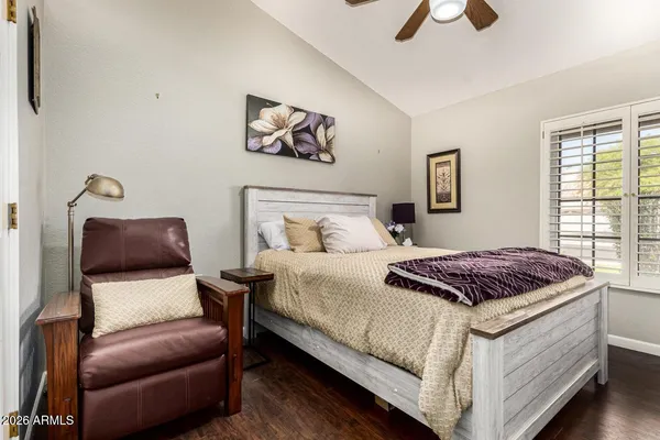 a bedroom with a bed and window