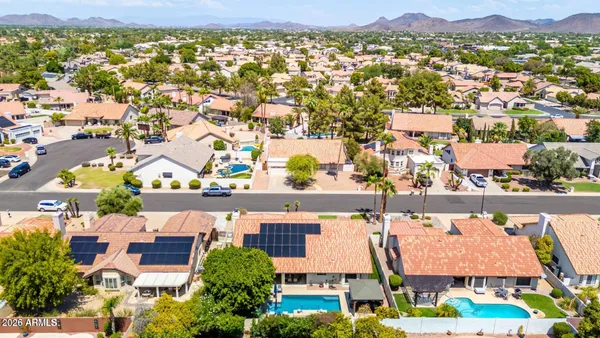 an aerial view of residential houses and outdoor space
