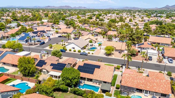 an aerial view of residential houses with outdoor space