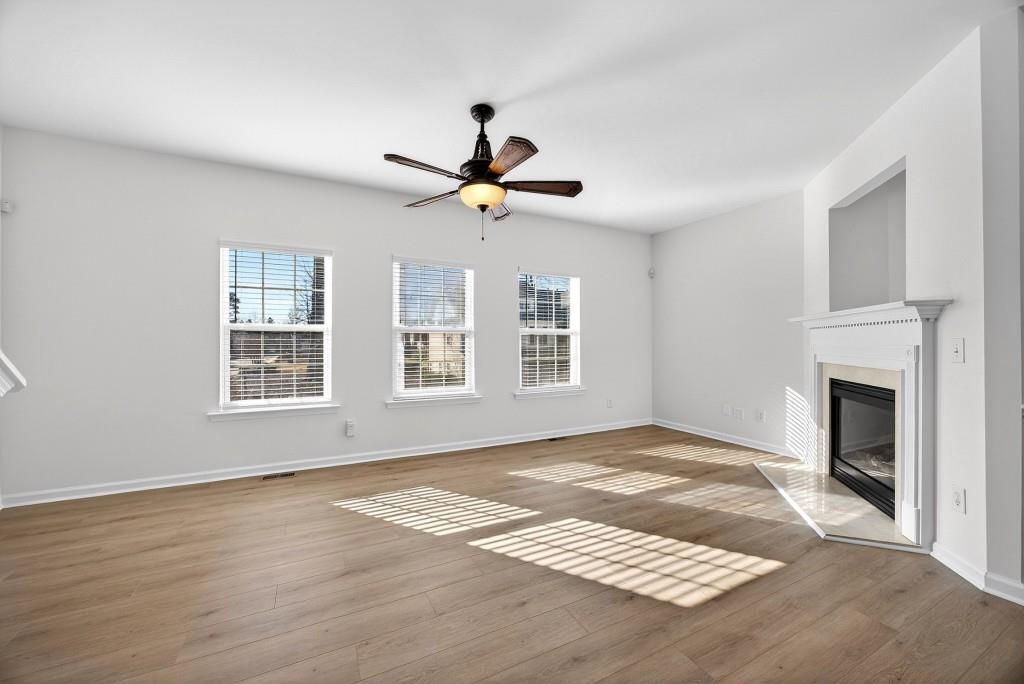1646 Austin Meadows Drive Decatur, GA 30032 - Photo 17 of 29 a view of an empty room with window and a fireplace