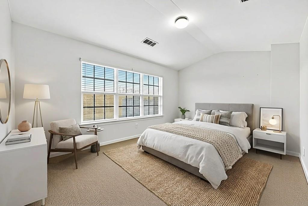 1646 Austin Meadows Drive Decatur, GA 30032 - Photo 19 of 29 a spacious bedroom with a bed and a window