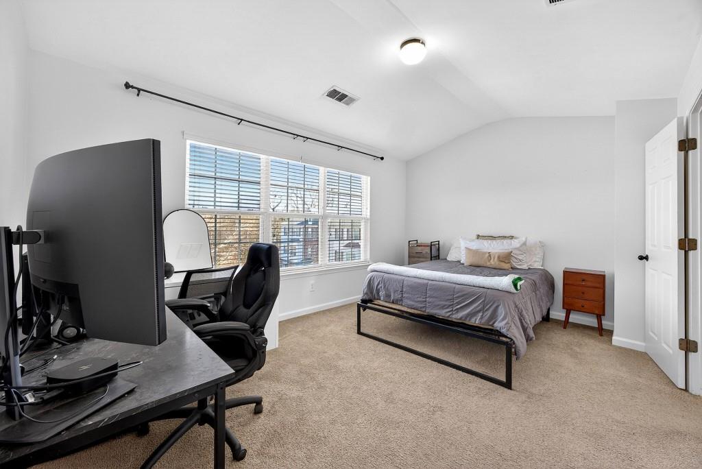 1646 Austin Meadows Drive Decatur, GA 30032 - Photo 20 of 29 a bedroom with bed chair and a window