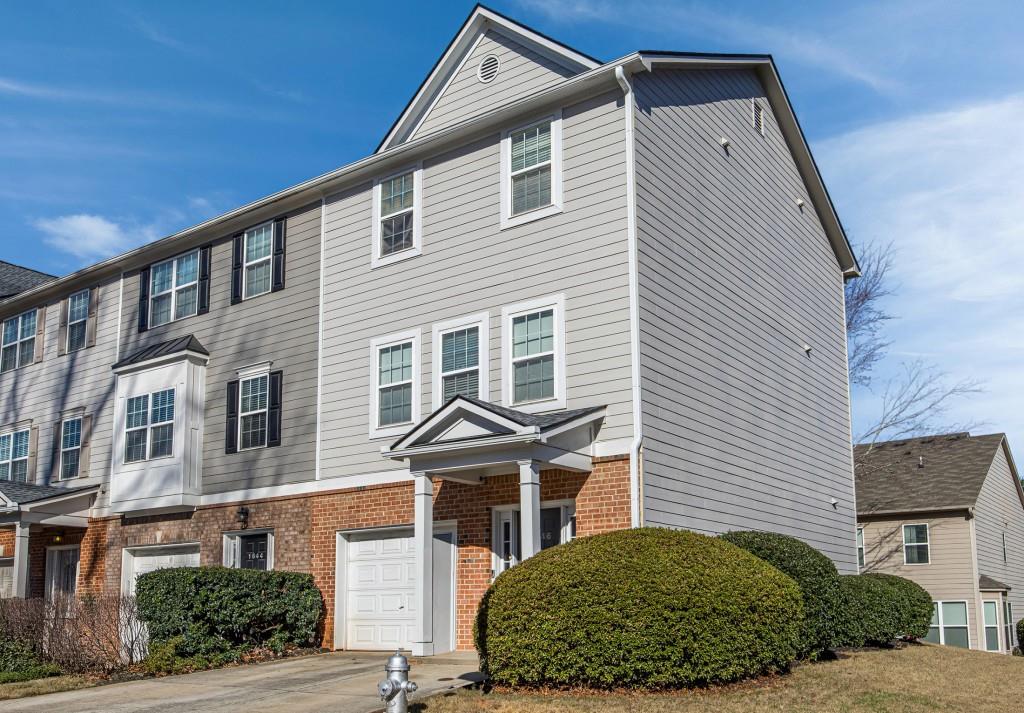 1646 Austin Meadows Drive Decatur, GA 30032 - Photo 2 of 29 a front view of a house with a yard