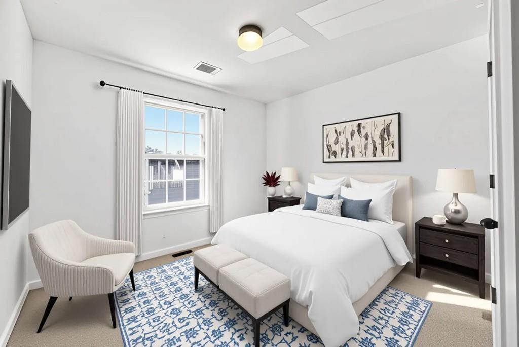 1646 Austin Meadows Drive Decatur, GA 30032 - Photo 23 of 29 a bedroom with a bed and a chair