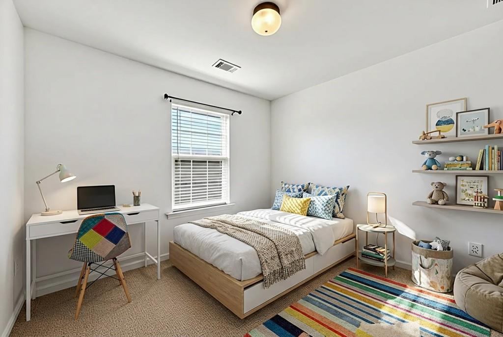 1646 Austin Meadows Drive Decatur, GA 30032 - Photo 26 of 29 a bedroom with a bed and a desk