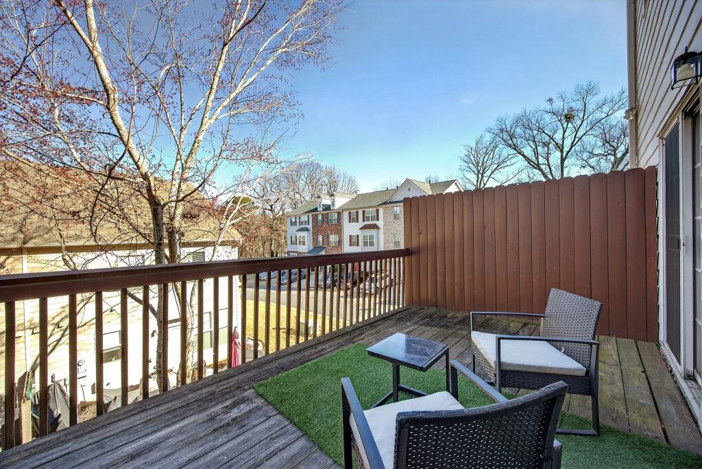 1646 Austin Meadows Drive Decatur, GA 30032 - Photo 27 of 29 a view of a chair and tables in the balcony