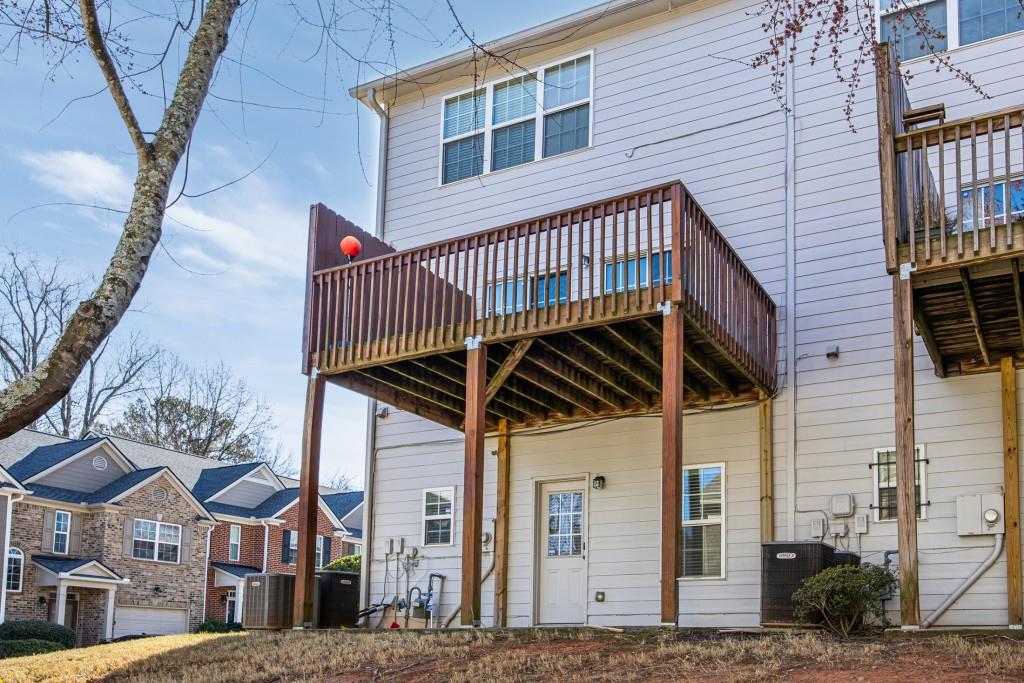 1646 Austin Meadows Drive Decatur, GA 30032 - Photo 29 of 29 a view of a wooden house with a large door