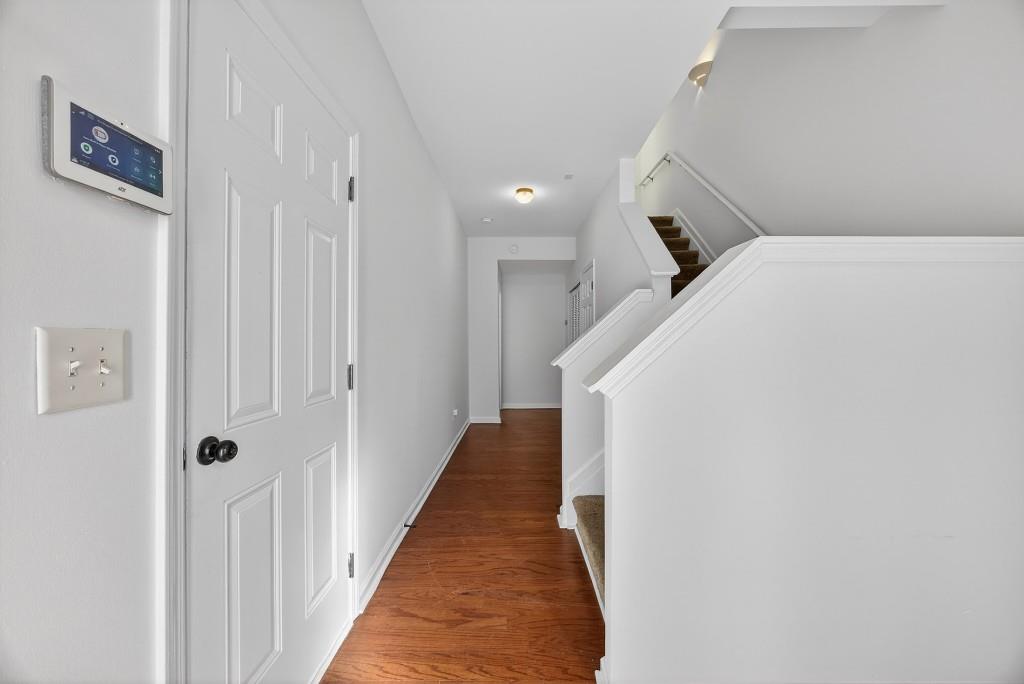 1646 Austin Meadows Drive Decatur, GA 30032 - Photo 5 of 29 a view of a hallway with wooden floor and staircase