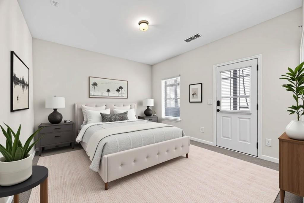 1646 Austin Meadows Drive Decatur, GA 30032 - Photo 6 of 29 a spacious bedroom with a large bed and a potted plant