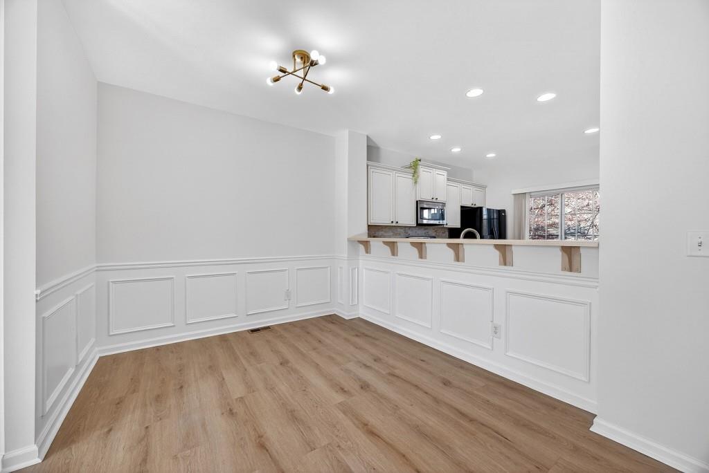 1646 Austin Meadows Drive Decatur, GA 30032 - Photo 10 of 29 a view of a kitchen with wooden floor and cabinets