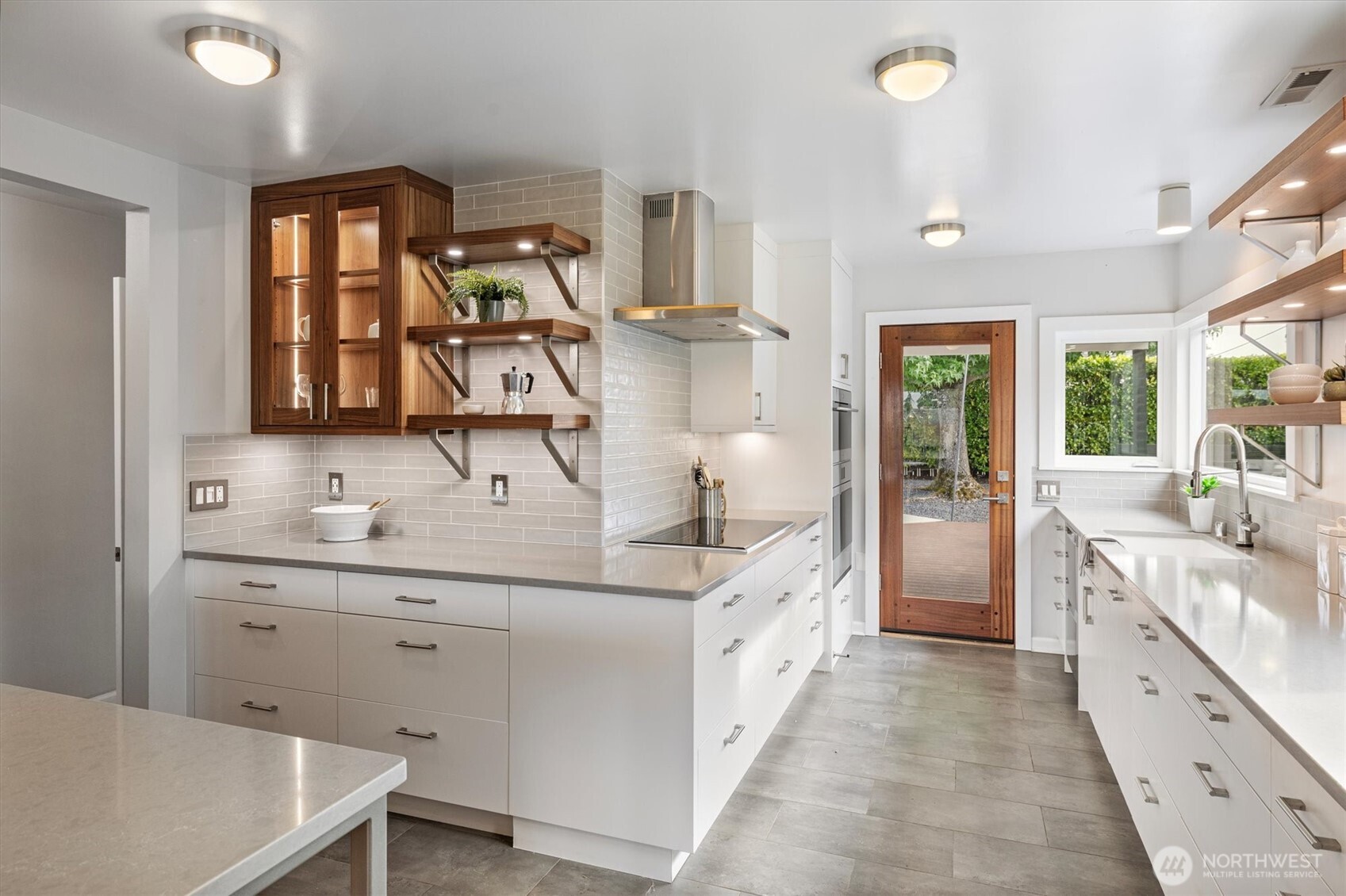 1940 Edgemont Place West Seattle, WA 98199 - Photo 14 of 37 a spacious bathroom with a double vanity sink and a mirror