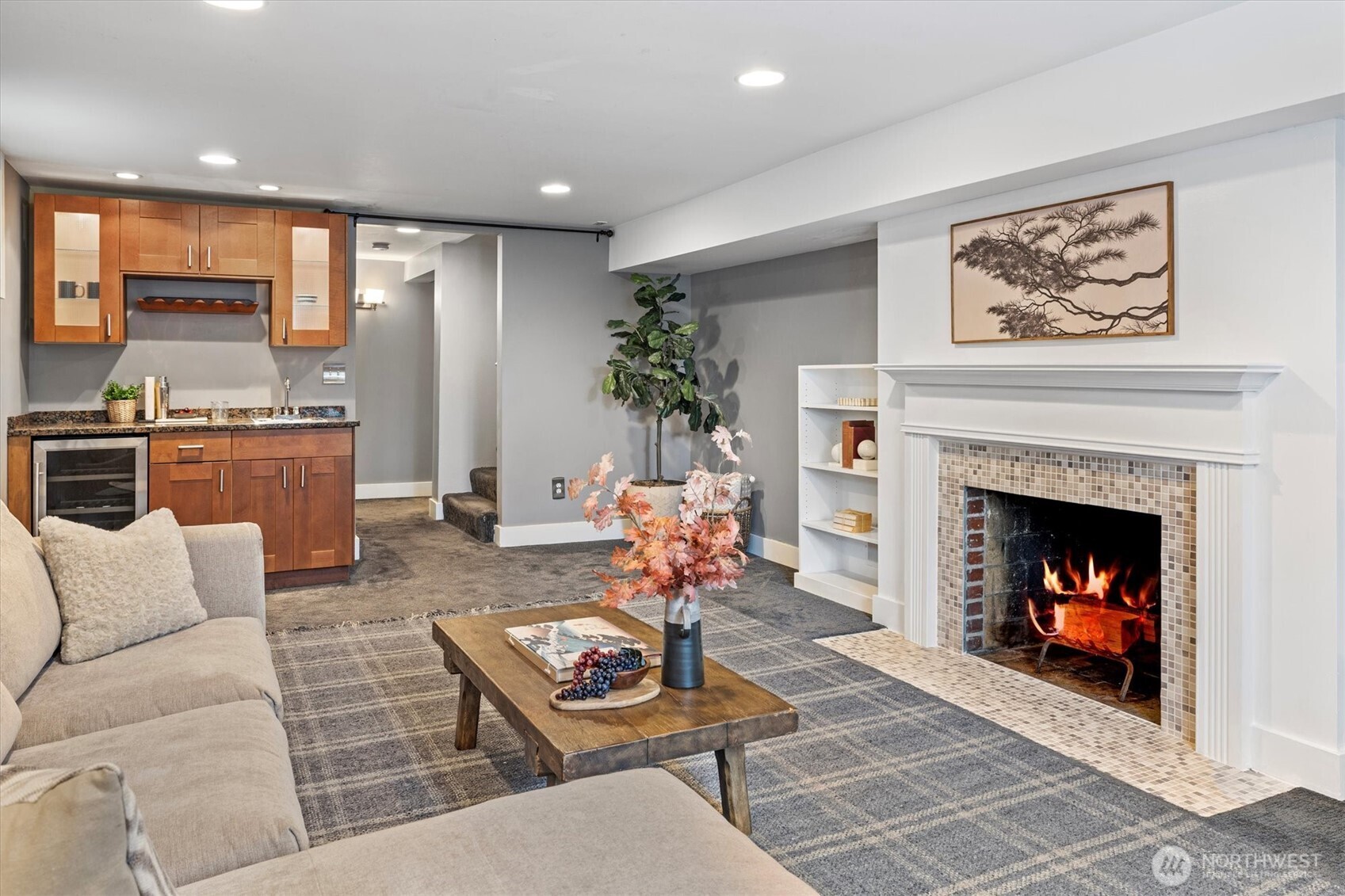 1940 Edgemont Place West Seattle, WA 98199 - Photo 21 of 37 a living room with furniture a fireplace and kitchen view