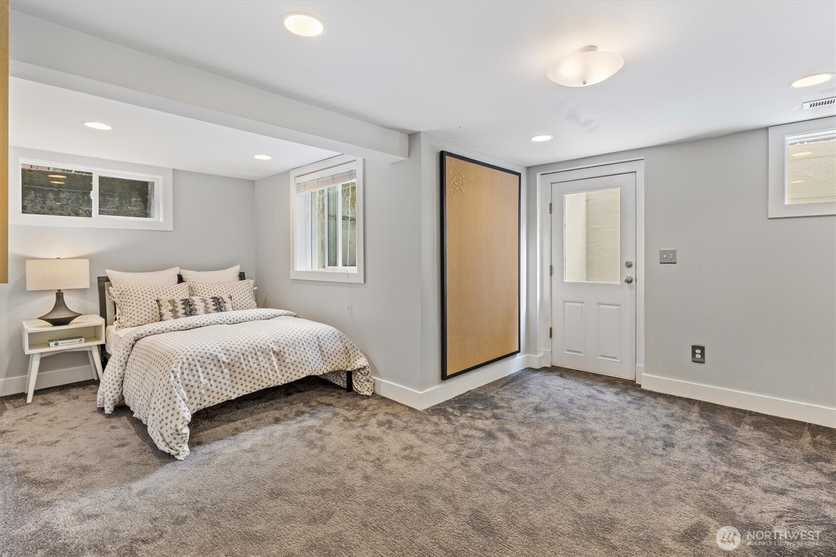 1940 Edgemont Place West Seattle, WA 98199 - Photo 22 of 37 a spacious bedroom with a bed and a window